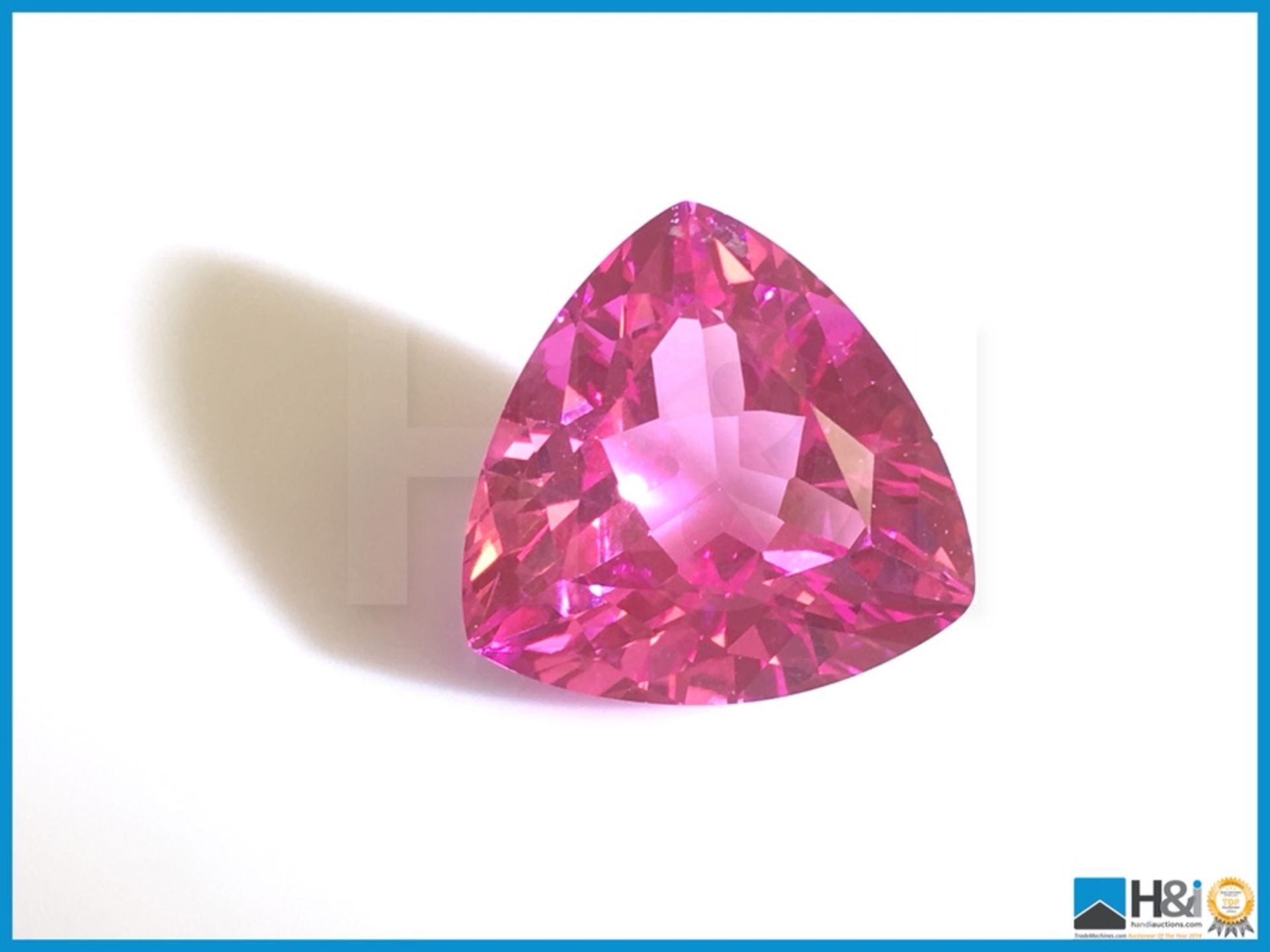 17.84ct Natural Pink Topaz. Trillion Facetted Cut. Transparent 16.50x16.50x10.7mm. Certification: