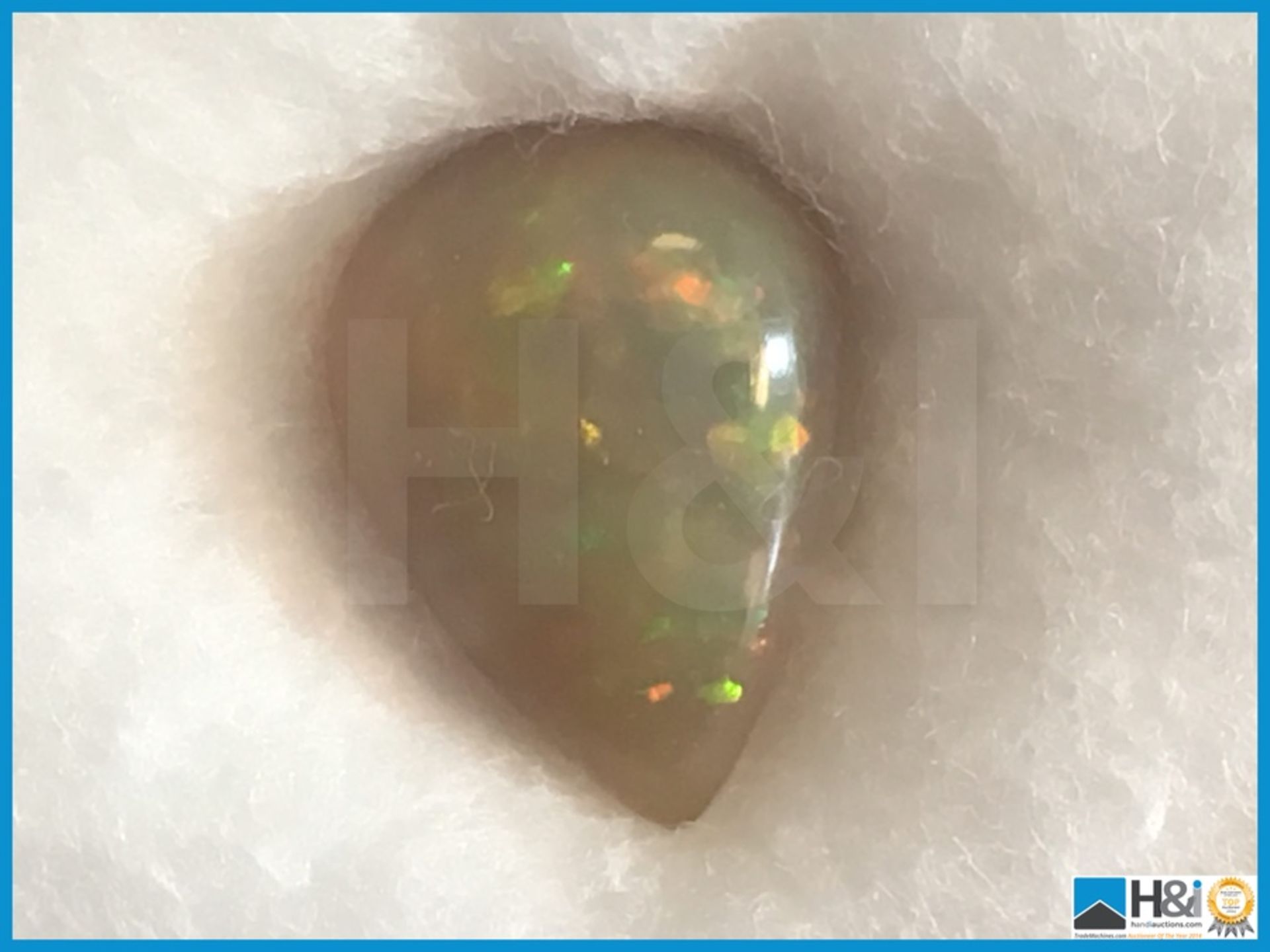 2.40ct Natural Opal. Pear Cabochon in white with play of colours. Size: 12.28x8.91x4.63mm.