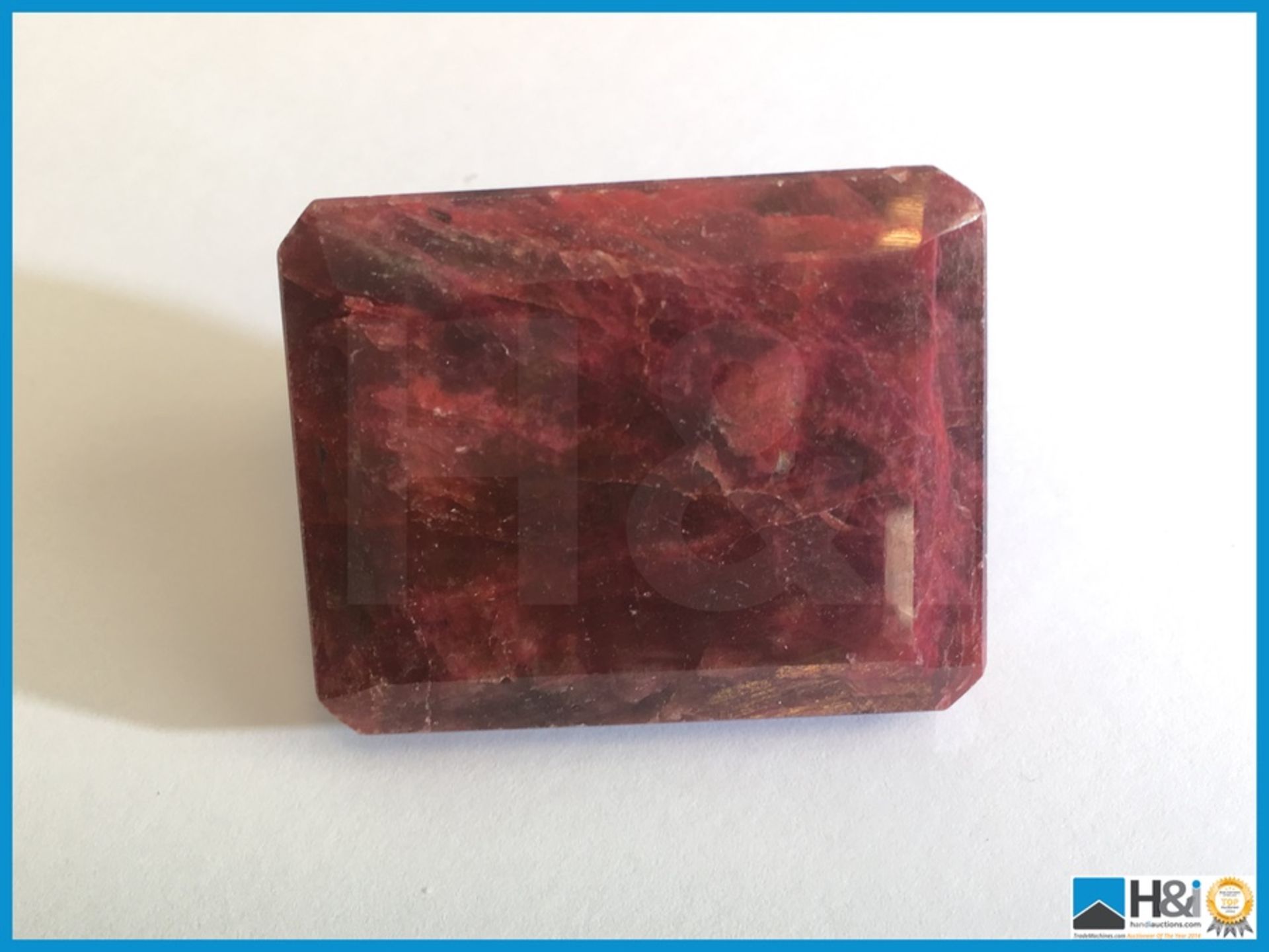 394ct Natural Ruby. Octagonal Step Cut in Red. Size: 41x34x21mm. Certification: None Appraisal:
