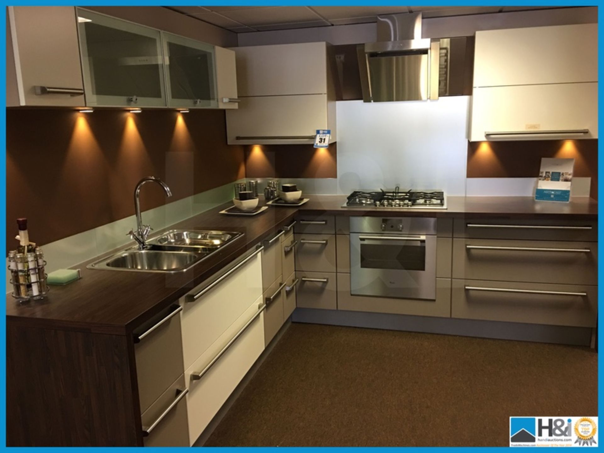 Beautiful contemporary display kitchen compete with dark walnut effect worktop and multi purpose