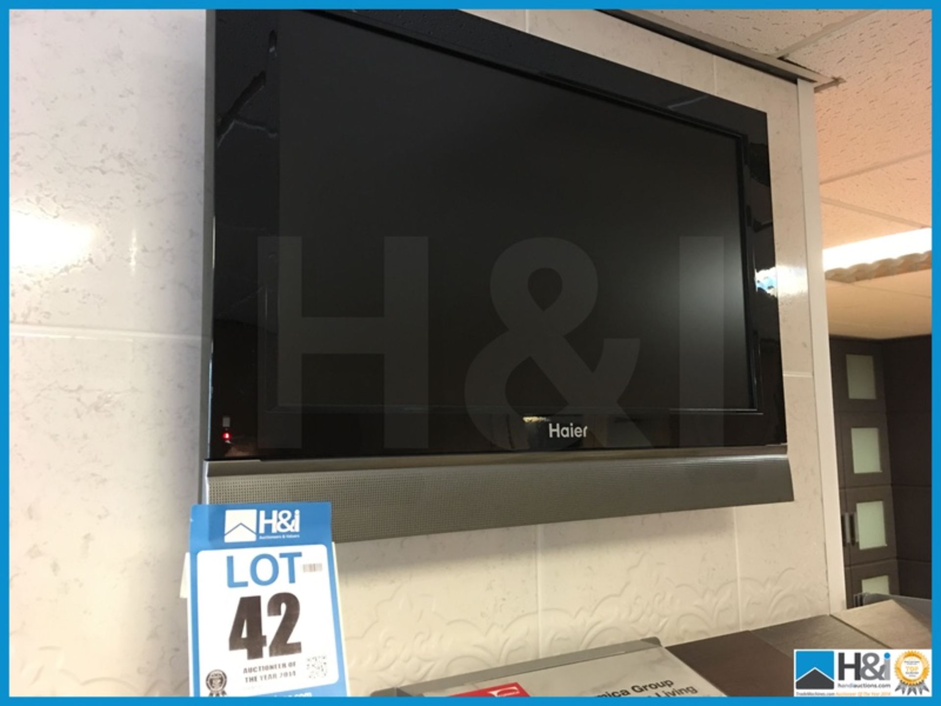 Haier 21in flat screen TV and wall bracket Appraisal: Excellent Serial No: NA Location: West