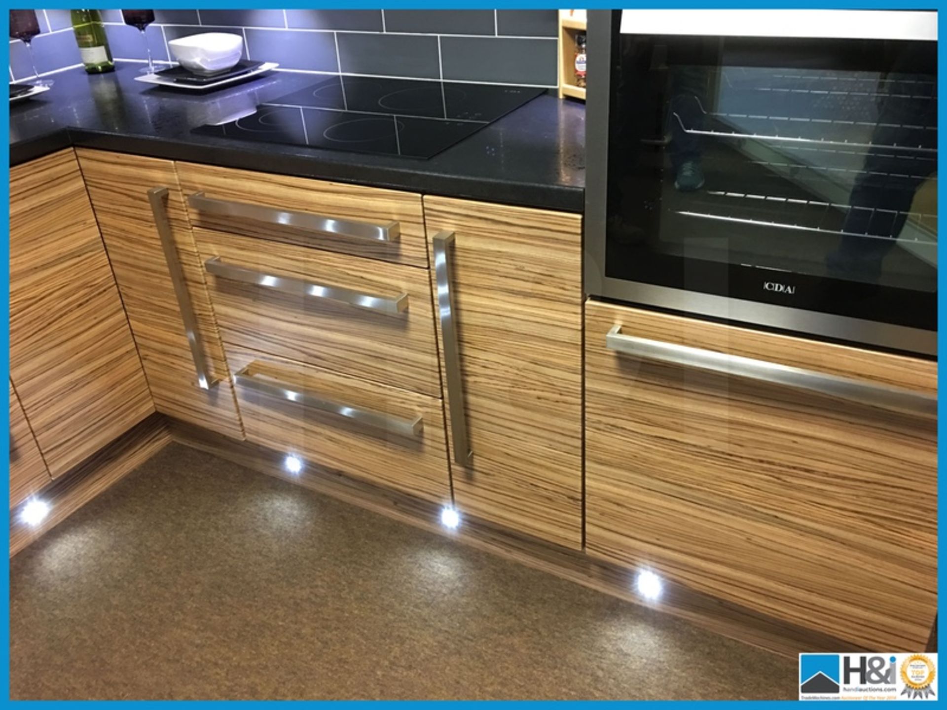 Stunning display kitchen finished in zebrano with black textured worktop, stainless steel 1.5 bowl - Image 5 of 19