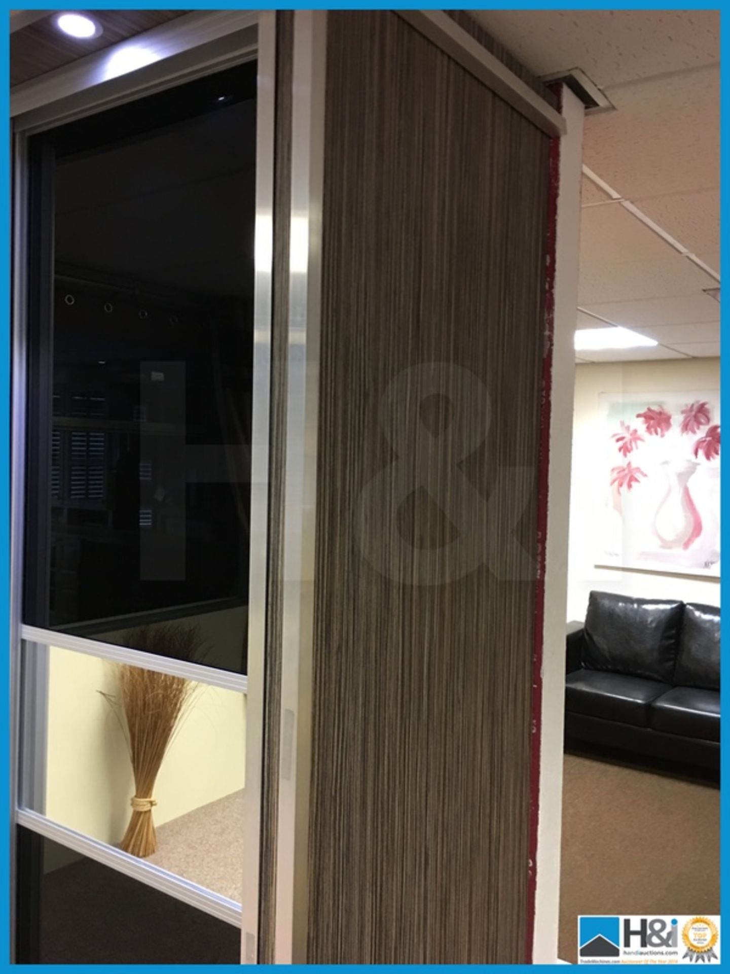 Dark glass and mirrored sliding door wardrobe with LED lighting to upper exterior. 1970mm x 650mm - Image 2 of 5