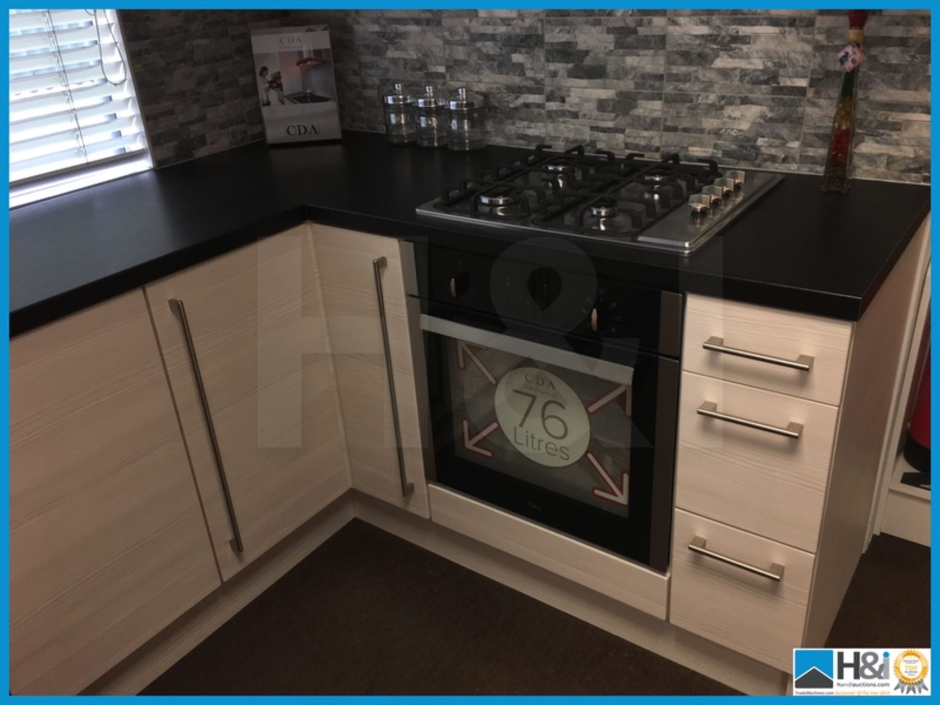 Absolutely stunning display kitchen in white avola with textured black worktop, LED lighting and - Image 4 of 12