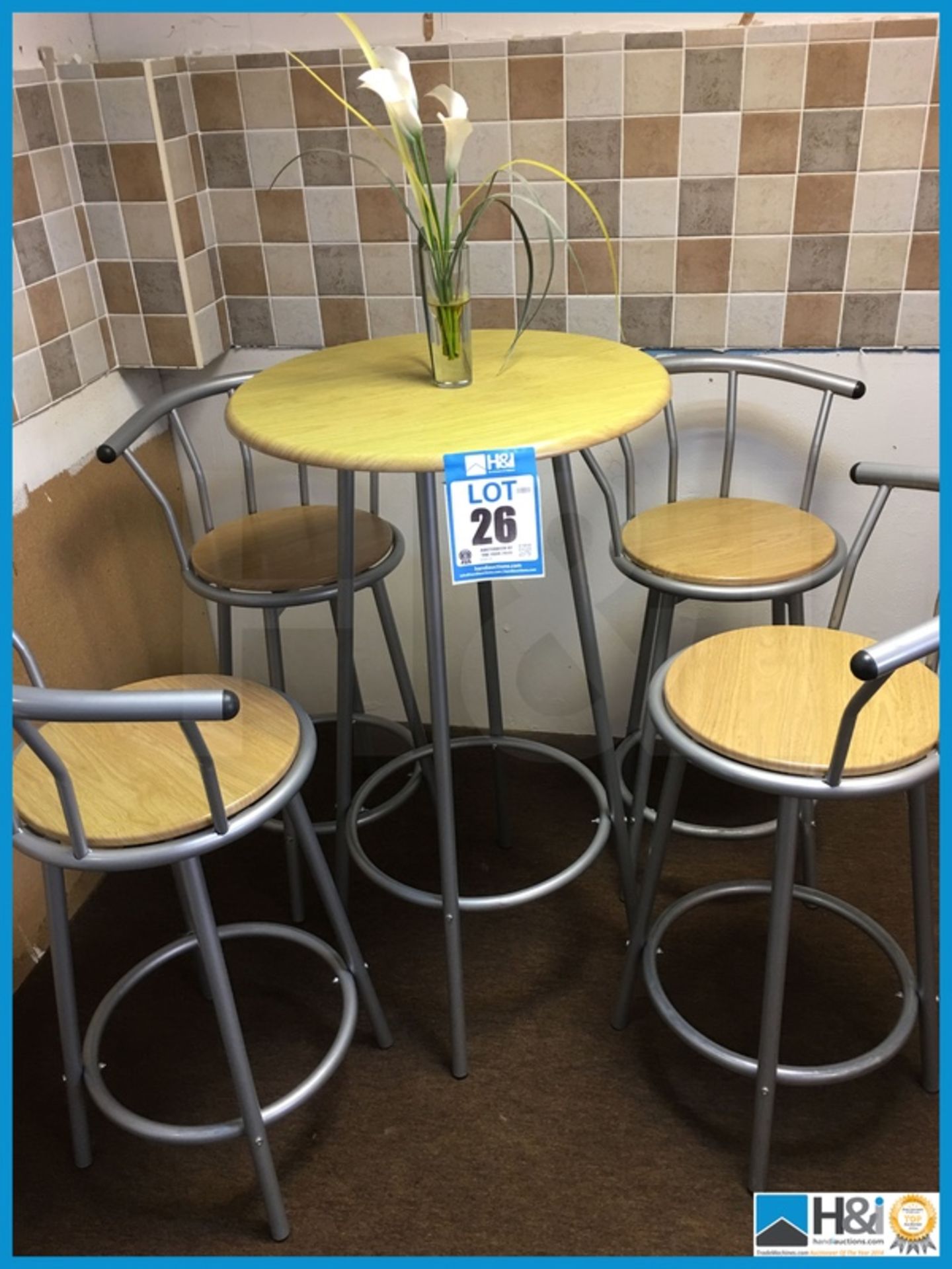 Tall table compete with four tall swivel stools. Excellent condition Appraisal: Excellent Serial No: