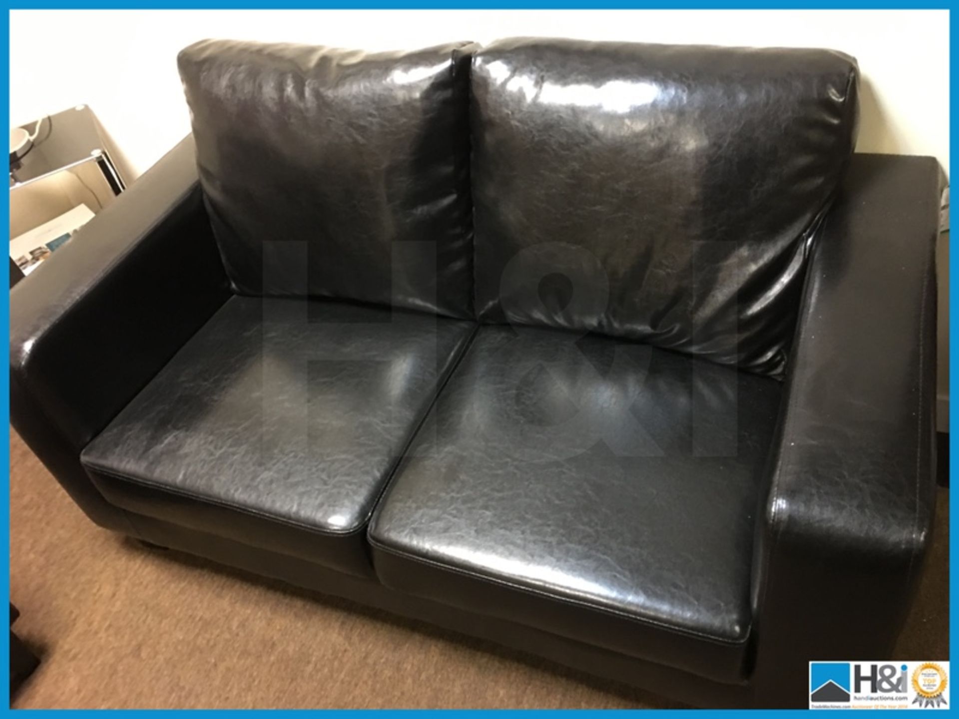 Black leather sofa and chair and glass top table with lamp and canvas art to wall Appraisal: - Image 6 of 7