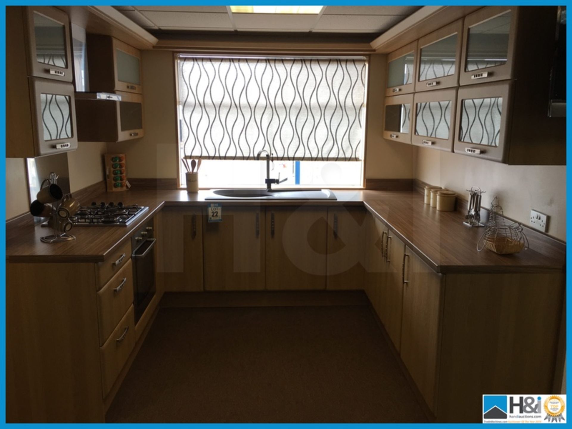 Stunning contemporary design display kitchen finished in Oak with matching worktop. Come with