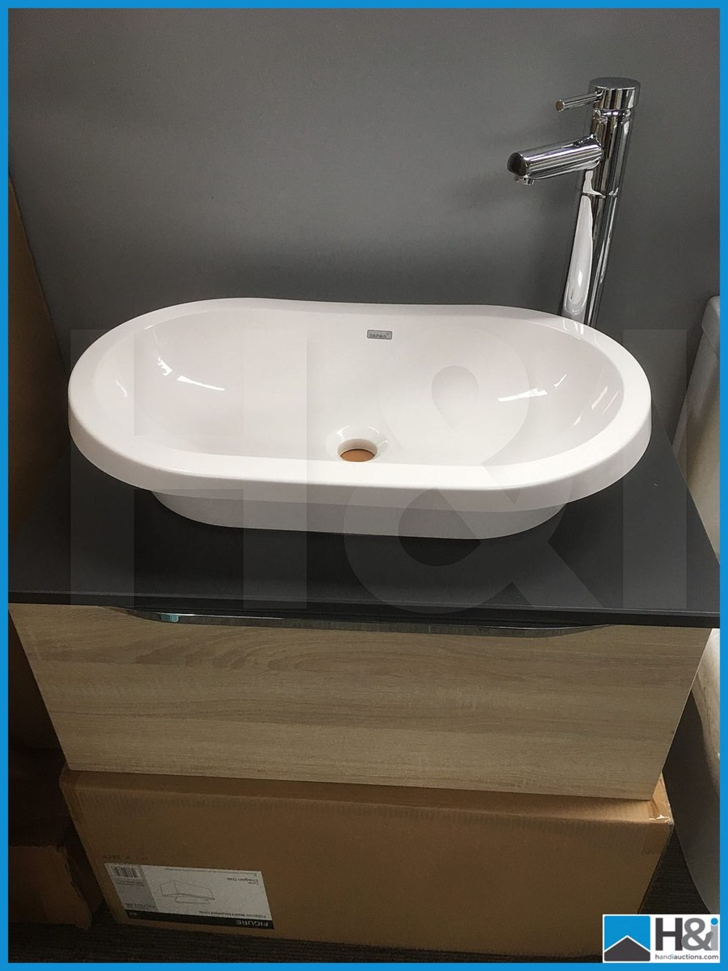 Magnificent wall hung vanity unit finished in Oregon Oak with slate composite worktop, Bauhaus