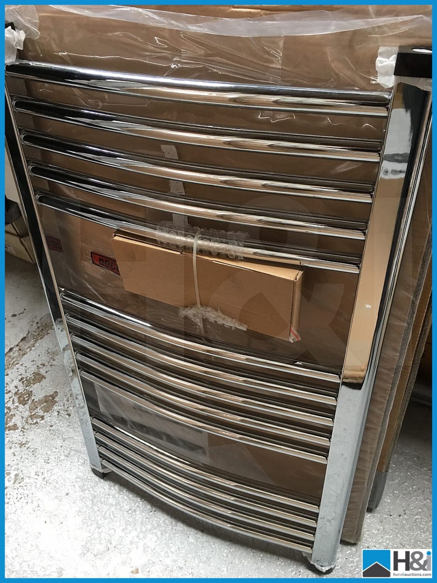 Designer polished chrome 800x500 curved towel rail. Complete with fittings. New and boxed. Suggested