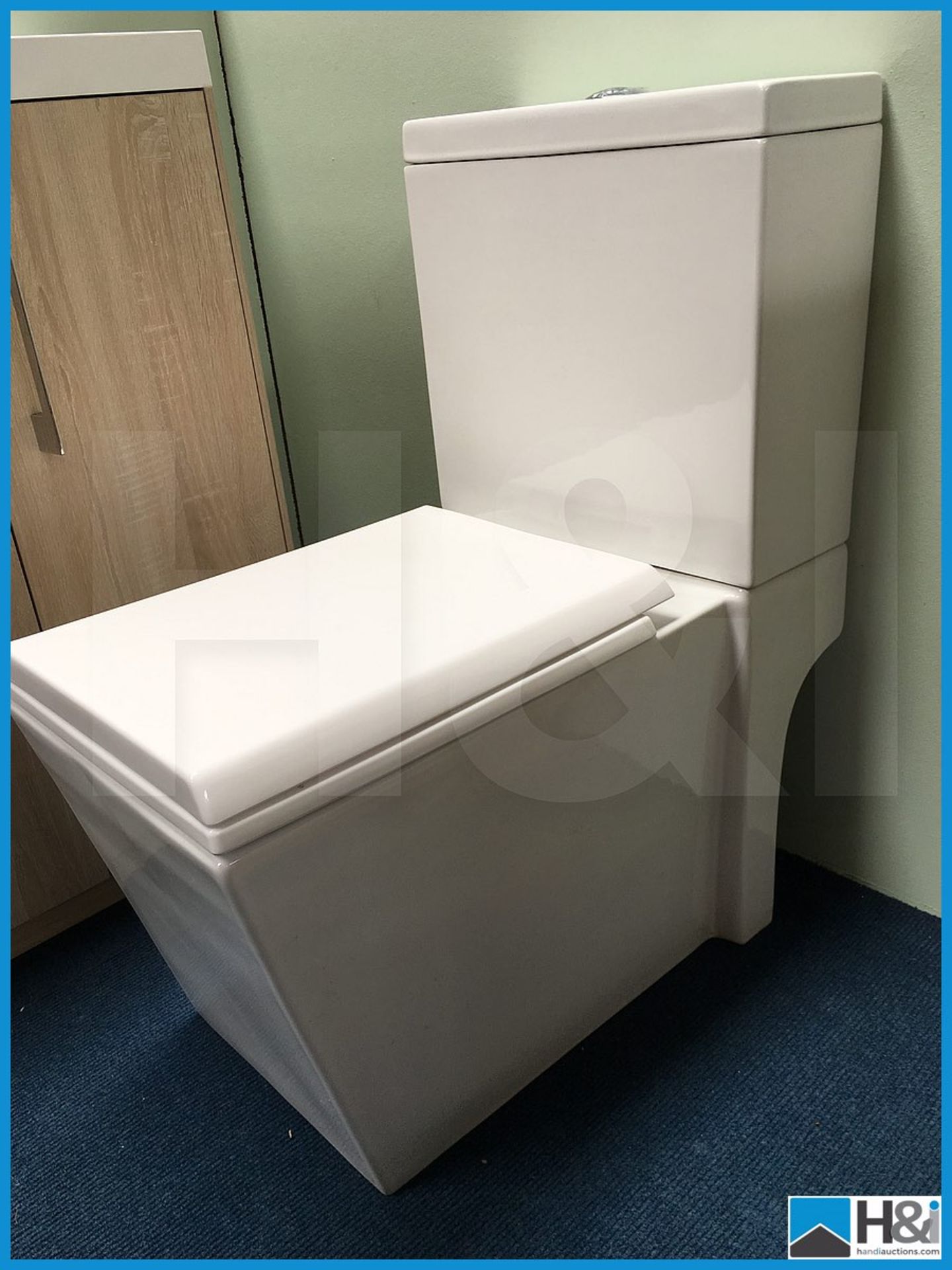 Stunning contemporary Milan square style close couple WC with top flush and soft close seat. New and