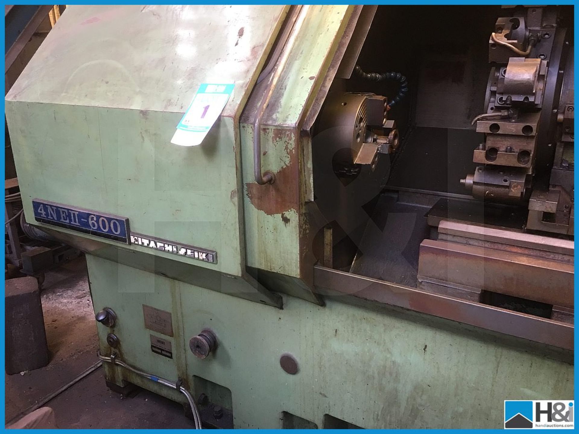 Hitachi Seiki 4NE II-600 CNC lathe machining center with original user manuals. Comes with swarf - Image 7 of 10