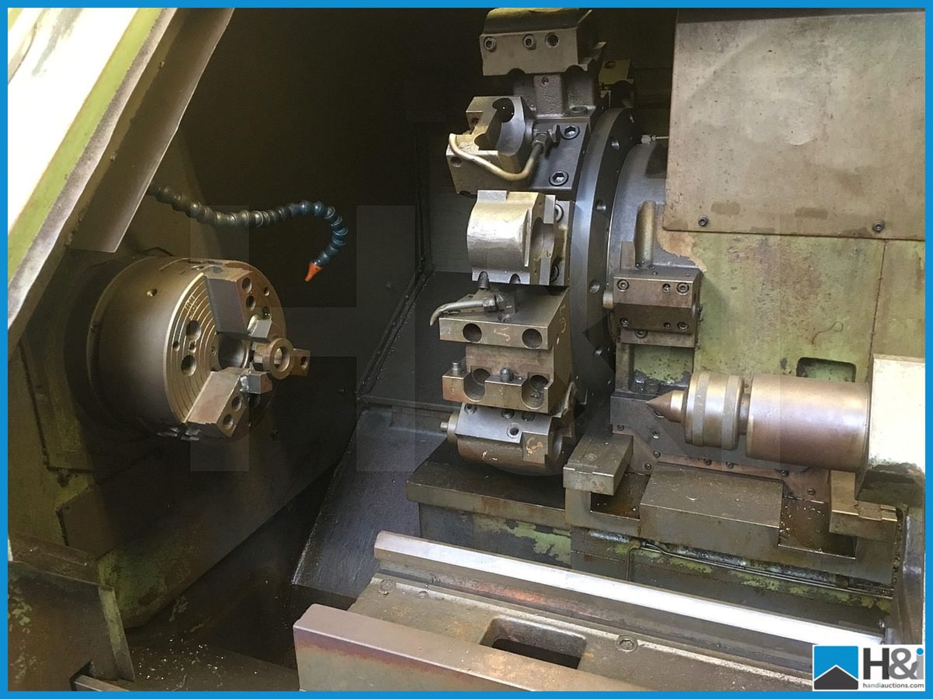 Hitachi Seiki 4NE II-600 CNC lathe machining center with original user manuals. Comes with swarf - Image 4 of 10