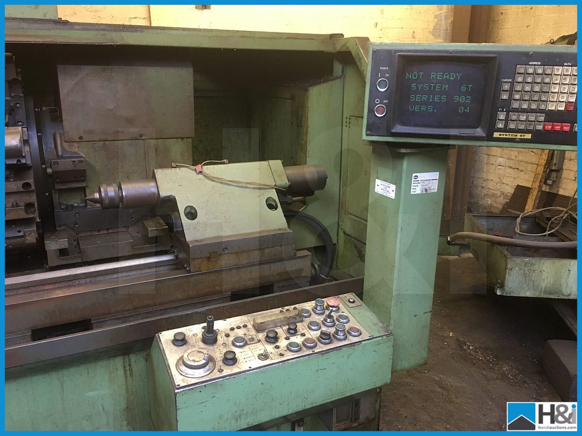 Hitachi Seiki 4NE II-600 CNC lathe machining center with original user manuals. Comes with swarf - Image 2 of 10