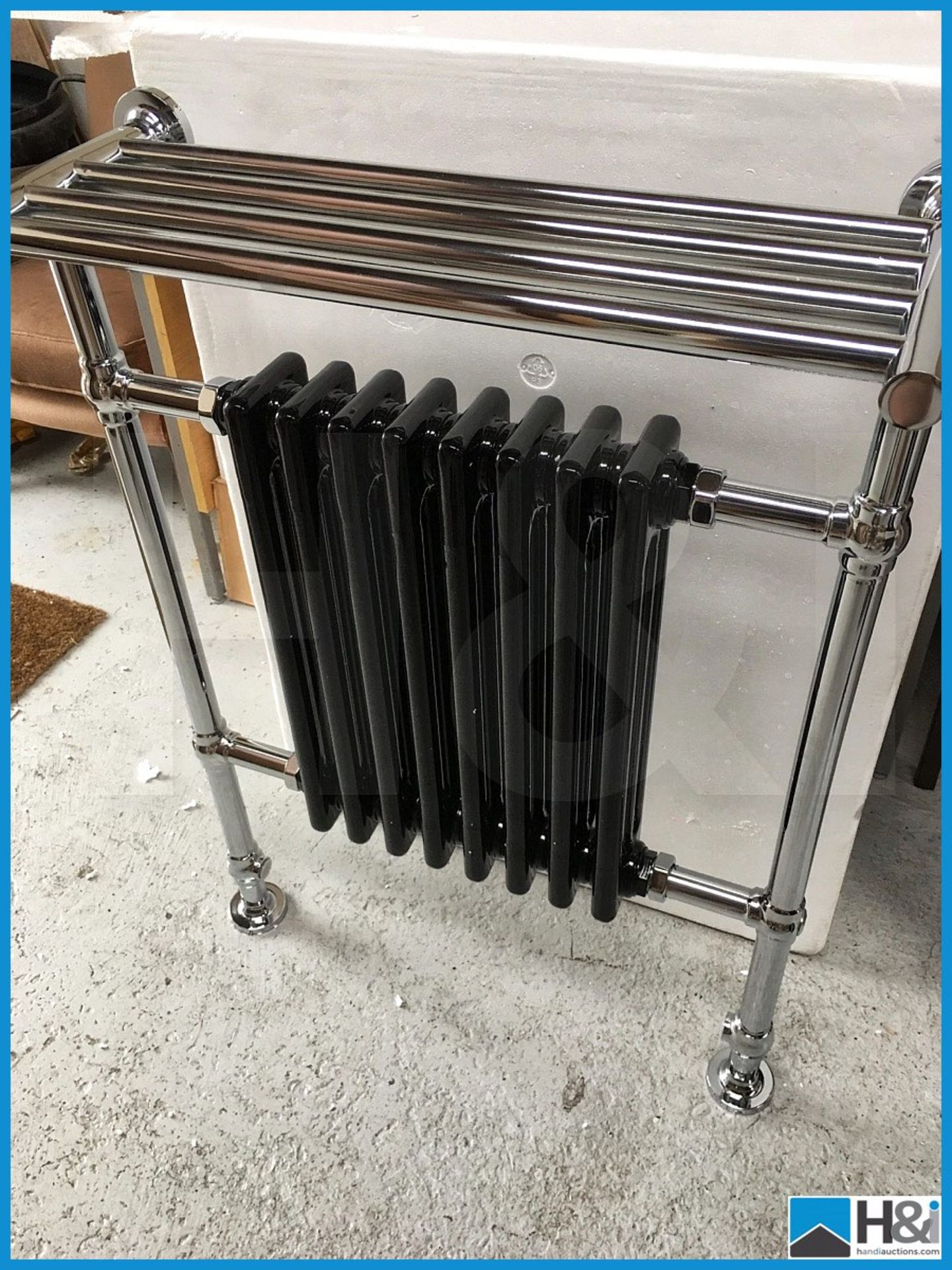 Designer centre column black traditional radiator with polished chrome rails. New and boxed.