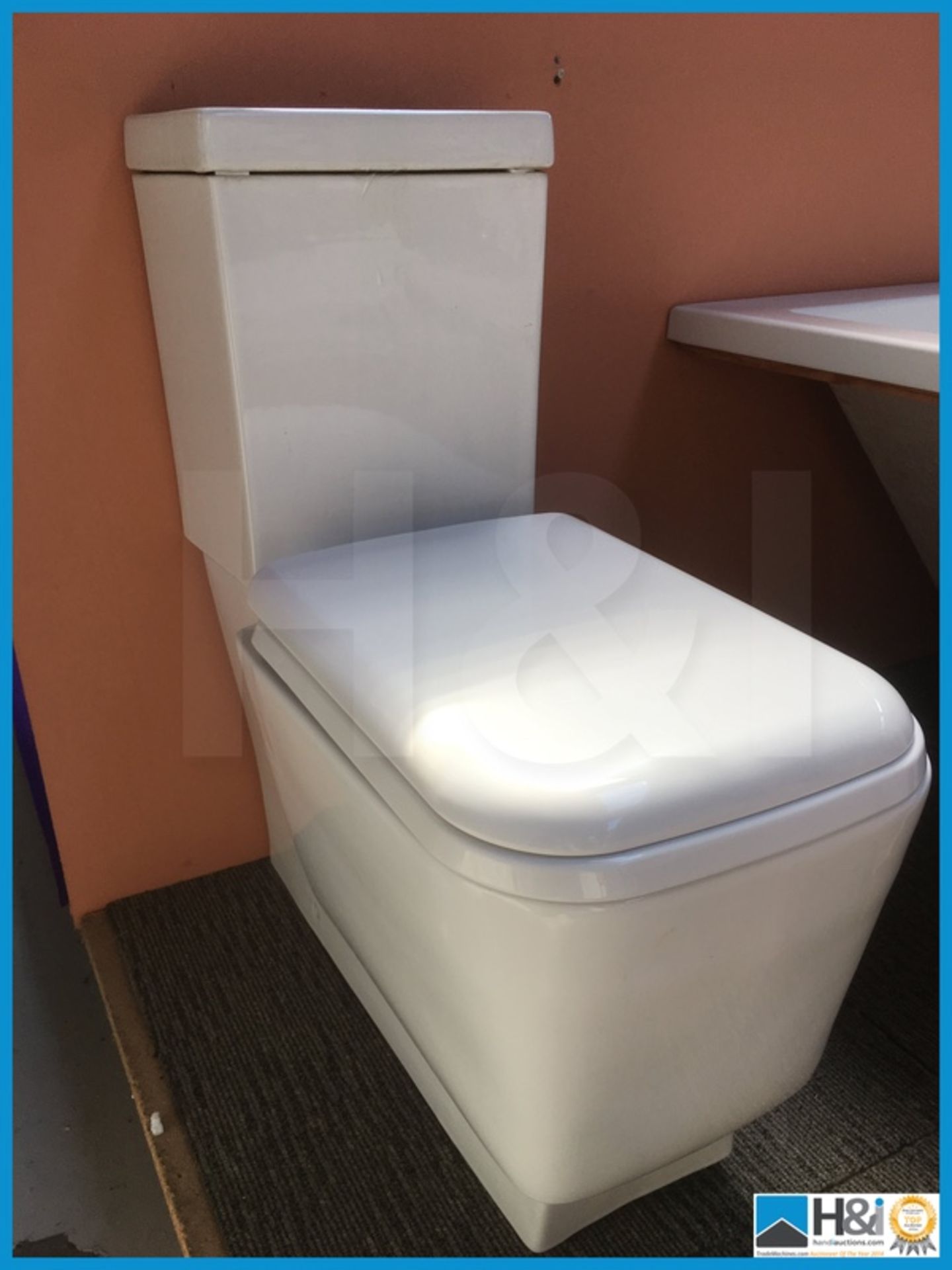 Beautiful designer square contemporary toilet with matching soft close seat. New and boxed.