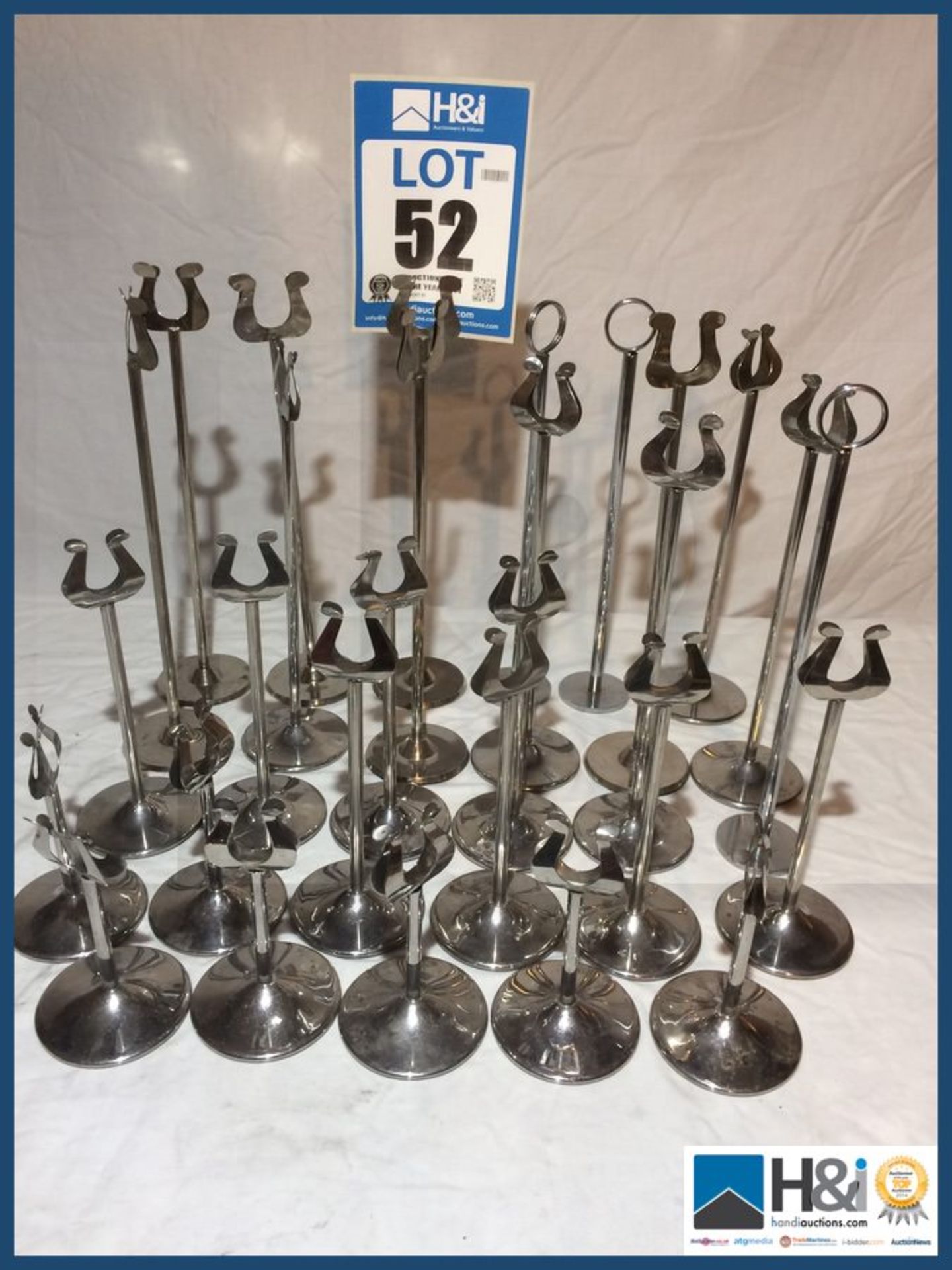 29 X TABLE NUMBER STANDS SILVER COLOURED 7 X 140MM 8 X 200MM 14 X 310MM Appraisal: Viewing Advised