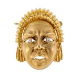 Élément en or 750 brossé et poli à décor d'un masque dont les yeux sont sertis de diamants- h. 3 cm-