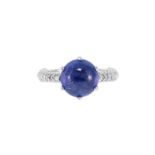 Bague en or gris 750 sertie d'une tanzanite cabochon épaulée de diamants- doigt 54-14 /