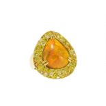 Bague en or 750 sertie d'une opale entourée de diamants jaunes taille brillant- doigt 53-13- 12g /