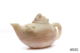 A CHINESE CARVED NATURALISTIC TEAPOT