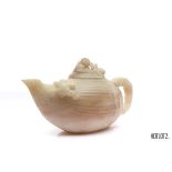 A CHINESE CARVED NATURALISTIC TEAPOT