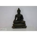 A BRONZE MODEL OF SITTING BUDDHA
