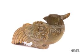 A CHINESE CARVING OF A BIRD