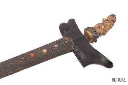 AN INDONESIAN KRIS WITH JEWELLED GILT-METAL HILT