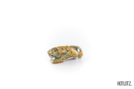 A CHINESE SMALL CARVED JADE LION