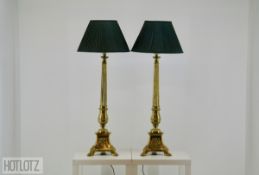 A PAIR OF VERY LARGE REGENCY STYLE GILT BRASS LAMPS