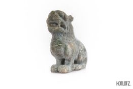 A CHINESE CARVING OF A SEATED MYTHICAL BEAST