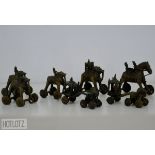A LARGE GROUP OF ANTIQUE INDIAN PUSH ALONG TOY ELEPHANTS