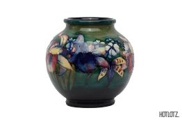 A MOORCROFT 'IRISES' GLOBULAR POTTERY VASE