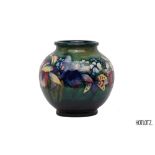 A MOORCROFT 'IRISES' GLOBULAR POTTERY VASE