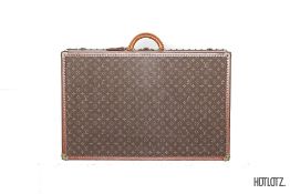 LOUIS VUITTON - A MONOGRAMMED CANVAS SUITCASE