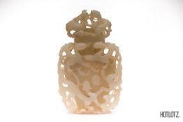 A CHINESE JADE CARVED AND RETICULATED VASE AND COVER