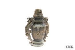 A CHINESE CARVED DRAGON HANDLED VASE AND COVER