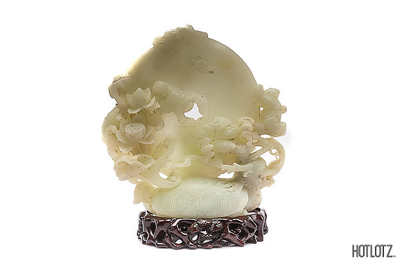 A CHINESE CARVED JADE DISC