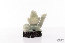 A CHINESE JADE DRAGON VASE AND COVER