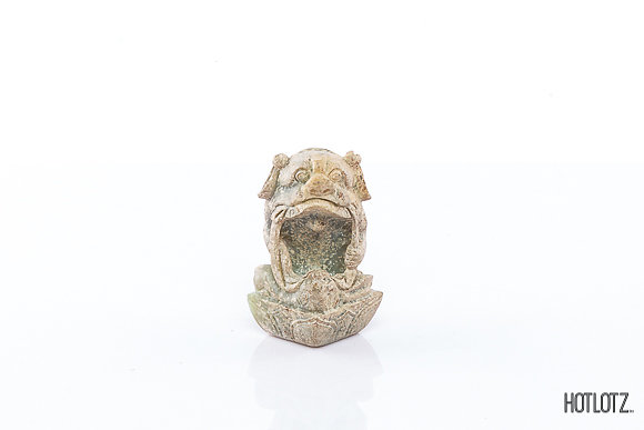 A CHINESE CARVING OF A FOO DOG WITH BALL