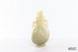 A CHINESE TWIN HANDLED JADE VASE AND COVER