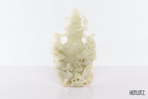 A CHINESE JADE DRAGON AND PHOENIX VASE AND COVER