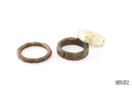 THREE CHINESE CARVED STONE ARCHAISTIC STYLE BANGLES