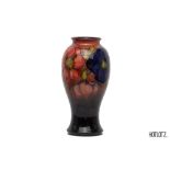 A MOORCROFT 'CLEMATIS' BALUSTER POTTERY VASE
