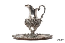 A LARGE PORTUGUESE SILVER EWER AND TRAY