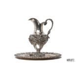 A LARGE PORTUGUESE SILVER EWER AND TRAY