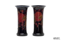 TWO MOORCROFT 'POMEGRANATE' TRUMPET POTTERY VASES