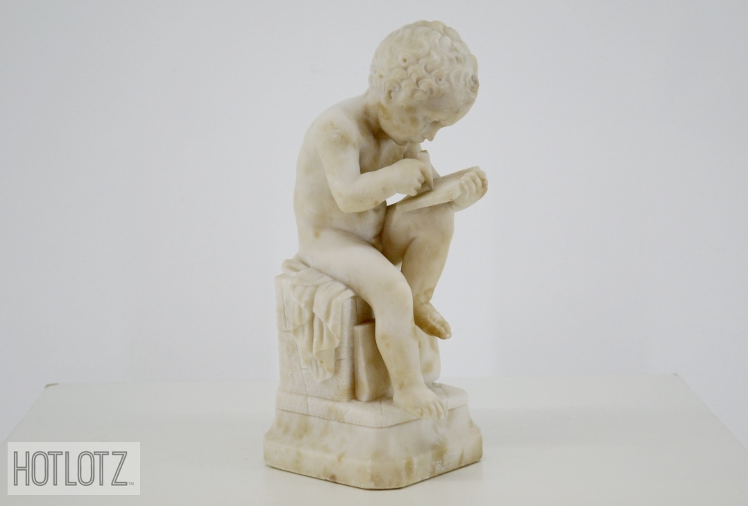 AN ITALIAN CARVED MARBLE FIGURE OF A BOY