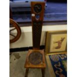 A carved spinning chair with Isle of Man style decoration, hard seat, on ring turned legs