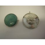 A large circular turquoise Ruskin brooch mounted in sterling silver and a large circular silver